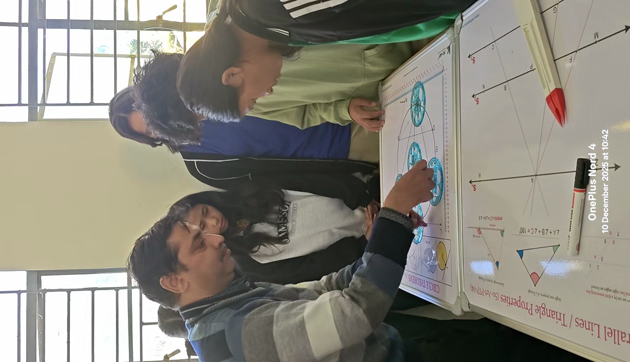 Student pointing out Circle Theorems on the apparatus board
